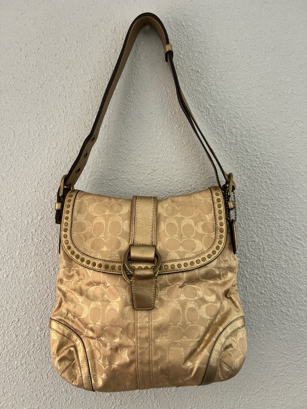 Coach gold & tan shoulder bag with repeating beige C logo pattern